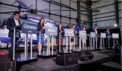  ?? CP PHOTO JEFF MCINTOSH ?? From left, candidates Todd Loewen, Danielle Smith, Rajan Sawhney, Rebecca Schulz, Leela Aheer, Travis Toews and Brian Jean attend the United Conservati­ve Party leadership candidate’s debate in Medicine Hat on July 27.