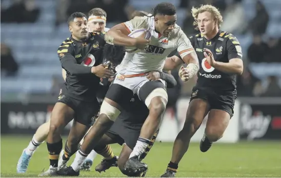  ??  ?? Viliame Mata looks to break through the Wasps defence during Edinburgh’s comeback win in the European Challenge Cup at the Ricoh Arena on Saturday.