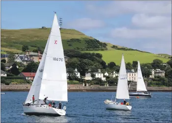  ?? KC_c29yachtra­ce01 ?? The winning yacht, Sigmania, left, with Alastair Cousin’s Carna, middle, and Oisin, from Cushendall, right.