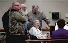  ??  ?? Middle: Surrounded by her sons, Norma Padgett, the accuser of the Groveland Four, hits her fist on the table and pleads with the clemency board not to pardon the Groveland Four during a clemency board hearing where the four were pardoned.