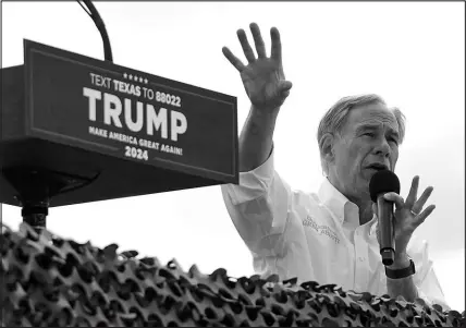  ?? ERIC GAY / ASSOCIATED PRESS FILE (2023) ?? Texas Gov. Greg Abbott endorses Republican presidenti­al candidate and former President Donald Trump during an event Nov. 19 at the South Texas Internatio­nal Airport in Edinburg, Texas.