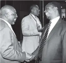  ??  ?? Foreign Affairs Permanent Secretary Ambassador Joey Bimha (left) shares a lighter moment with South African head of delegation to the Zimbabwe-South Africa Bi-National Commission Mr Xolisa Makaya in Harare yesterday