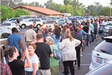  ?? MICHAEL CHOW/THE ARIZONA REPUBLIC ?? Voters wait in line to cast their ballots at Pilgrim Evangelica­l Lutheran Church in Mesa on March 22, 2016. Lines in the evening were around three hours.