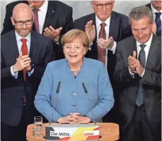  ?? MATTHIAS SCHRADER, AP ?? German Chancellor Angela Merkel has won election to a fourth term, but it will not all be smooth sailing. The right-wing nationalis­t AfD had a strong showing.