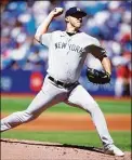  ?? Vaughn Ridley / Getty Images ?? Yankees starter Jameson Taillon delivers against the Blue Jays.