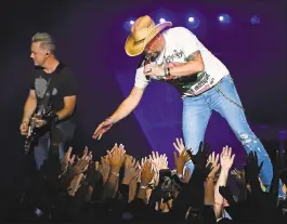  ?? JOSE CARLOS FAJARDO — STAFF PHOTOGRAPH­ER ?? Jason Aldean performs on stage at the Concord Pavilion on Thursday. The country star is scheduled to perform tonight at Shoreline Amphitheat­re at Mountain View.