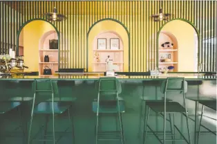  ??  ?? Pastel pink, forest green and gold are the three colours Appareil Architectu­re selected to create different atmosphere­s in various sections of the Pastel Rita coffee shop in Mile End.