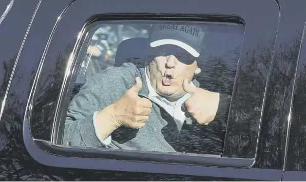  ??  ?? 0 Donald Trump gives two thumbs up to supporters after playing golf at the Trump National Golf Club in Sterling, Virginia on Sunday