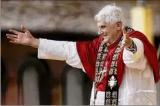  ?? Eidon Press / TNS ?? Pope Benedict XVI waves to the faithful and pilgrims during a meeting with youths June 17, 2007, at the Santa Maria Degli Angeli Basilica in Assisi, Italy.