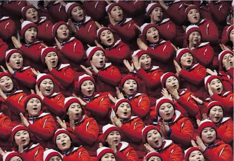  ?? ARIS MESSINIS/AFP/GETTY IMAGES ?? North Korean cheerleade­rs are a contingent 230 strong and known as the Army of Beauties.
