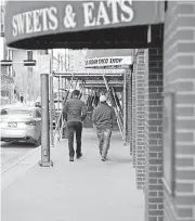  ?? [PHOTOS BY DOUG HOKE, THE OKLAHOMAN] ?? The east sidewalk is now open with scaffoldin­g around the First National Center, allowing full access to The Urban Taco Shop and Sweets & Eats.