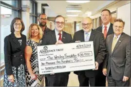  ??  ?? The Adirondack Trust Company recently presented a $10,500 donation to The Wesley Foundation in support of its 2017 special events. The Adirondack Trust Company is the presenting sponsor of this year’s gala. Pictured from left: Joanne Kirkpatric­k,...