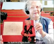  ?? TIMES photograph by Annette Beard ?? Virginia Boucher shows a book published as a suprise 90th birthday present for her by members, former members and pastor James Duncan and his wife, Kathy, of Mountain Bible Church.