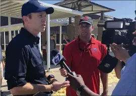  ?? PATRICIA SULLIVAN — THE WASHINGTON POST ?? FEMA director William “Brock” Long, left, visited communitie­s affected by Hurricane Michael in October 2018. Long resigned from the agency Wednesday.
