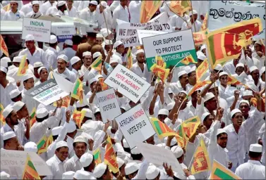  ??  ?? Hundreds of Muslims took to the streets on Thursday in a government-sponsored rally against the US sponsored Geneva resolution on Sri Lanka. The protest was held near the US Embassy in Kollupitiy­a. Pic by Indika Handuwala.