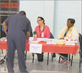  ?? STAFF PHOTOS BY ANDREW RICHARDSON ?? Karla Campos-Hunt, left, and Charlita Campbell, right, from the Charles County Department of Health attended the fourth annual re-entry fair at the Charles County Detention Center to provide inmates with informatio­n on how to get connected with...