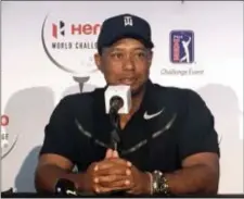  ?? DOUG FERGUSON — THE ASSOCIATED PRESS ?? Tiger Woods speaks at a press conference Golf Club in Nassau, Bahamas Tuesday. at the Albany