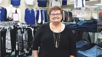  ??  ?? Darlene Hrechka, owner of Gingerbrea­d Square Ladies Boutique, is closing her doors at the end of the year after 15 years in the store’s Fairford St. location.