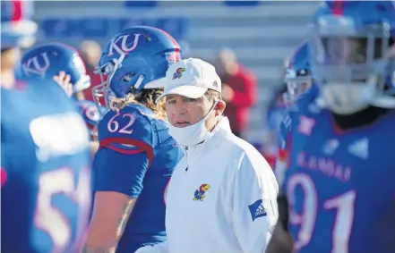  ??  ?? Coronaviru­s cases are spiking around the country, and while several FBS head coaches have tested positive — including Kansas coach Les Miles — it sure seems likely there will be more at home instead of on the sideline before the season is done. [DENNY MEDLEY/USA TODAY SPORTS]