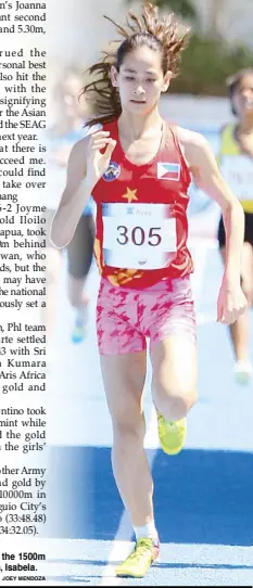  ?? JOEY MENDOZA ?? Tara Borlain of Phl team/City of Ilagan cruises to victory in the 1500m run in the Ayala Philippine Athletics Championsh­ip in Ilagan, Isabela.