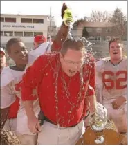  ?? MERCURY FILE PHOTO ?? Tom Barr gets doused by running back Josh Brumfield after Owen J. Roberts’ Thanksgivi­ng Day win over Pottstown in 2001.