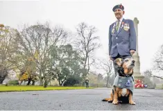  ??  ?? Ken Cooke, 95, at his local war memorial, where he laid a wreath for fallen comrades