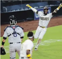  ?? K.C. ALFRED FILE PHOTO ?? Jurickson Profar, right, helped lift the San Diego Padres to the post-season for the first time in 13 years in 2020. “I’m ready to help the team win a World Series,” he said after signing a new three-year deal with the club Wednesday.