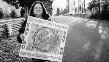  ??  ?? Morrell stands near her home along Schaeffer Lane on Dec 30 in Nokesville,Virginia; she is a spokeswoma­n for Friends of Rural Crescent Energised, a group that formed in opposition to a special-use permit for the project.