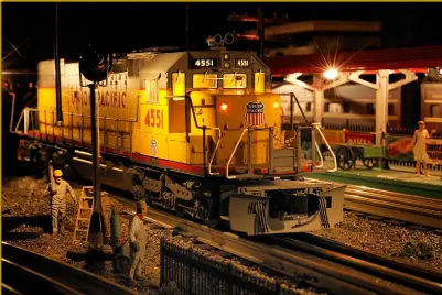  ??  ?? Using helpers or pushers is another exciting way to add another dimension to your operations. In this night scene, Union Pacific no. 4551 is waiting for the next train to come by to assist eastbound.