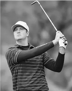  ??  ?? Hudson Swafford plays his second shot on the 14th hole during the final round of the CareerBuil­der Challenge in partnershi­p with The Clinton Foundation at the TPC Stadium Course at PGA West in La Quinta, California. — AFP photo