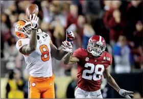  ?? AP/BEN MARGOT ?? Clemson’s Justyn Ross makes a one-handed catch in front of Alabama’s Josh Jobe during the second half of Monday’s College Football Playoff national championsh­ip in Santa Clara, Calif. Ross finished with 153 yards and 1 touchdown as the Tigers won 44-16.