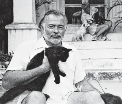  ?? A.E. Hotchner ?? Ernest Hemingway, who had an affinity for his pets, is shown at his home in Cuba during the 1950s.