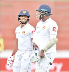  ?? - AFP photo ?? Kusal Mendis and Angelo Mathews put on an epic stand to save Sri Lanka from defeat in the first Test.