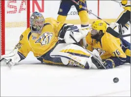  ?? AP PHOTO ?? Nashville Predators goalie Pekka Rinne and defenceman P.K. Subban stop a shot by the Pittsburgh Penguins during the second period in Game 3 of the Stanley Cup Finals.