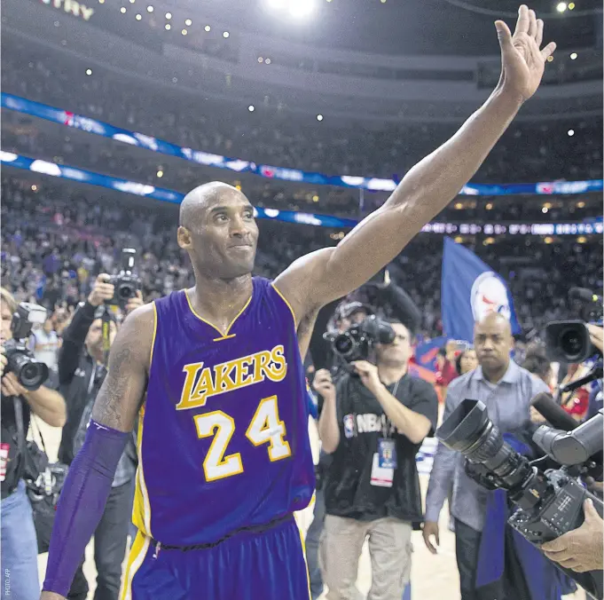  ??  ?? Kobe Bryant waves to the crowd after the game against the Philadelph­ia 76ers this week.