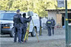  ?? DESMOND MURRAY /THE CANADIAN PRESS ?? Police are aided by a civilian with laser survey equipment searching a farm near Salmon Arm, B.C., on Monday. Police say human remains have been discovered on a rural property on Salmon River Road north of Vernon, B.C. RCMP Cpl. Dan Moskaluk says in a release that officers were executing a search warrant at the property on Saturday when the remains were found.