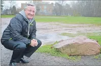  ?? DAVE STEWART/THE GUARDIAN ?? Charlottet­own Deputy Mayor Mike Duffy would like to see some changes made next to Victoria Park’s Memorial Field to create more parking. Removing the large boulders splitting the park in two would be one possibilit­y, and grading the muddy,...