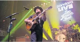  ?? JASON KEMPIN/GETTY ?? Zac Brown of Zac Brown Band performs onstage during the Pandora Live Zac Brown Band at Bud Light Dive Bar at The Tabernacle on Jan. 31 in Atlanta, Georgia.