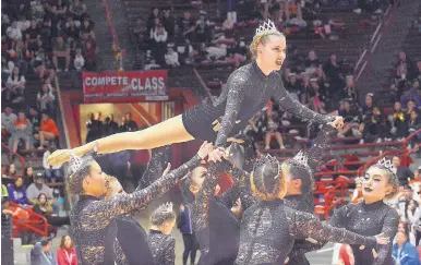  ?? JIM THOMPSON/JOURNAL ?? In black lace and tiaras, Volcano Vista performs its routine during competitio­n Saturday.