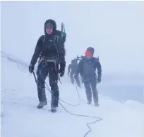  ??  ?? Far left: chinstraps share this stretch of beach at Ferguson Bay on
Thule Island with Adélie penguins.
Left: an attempt to climb Mt Belinda on Saunders was thwarted by savage weather.
Below: Dr Kieran Wood and Dr Emma Liu on Sanders Island