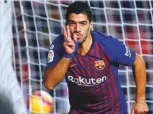  ?? AFP ?? Barcelona’s Luis Suarez celebrates after scoring a goal against Rayo Vallecano in La Liga at the Vallecas Stadium in Madrid on Saturday.