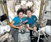  ?? NASA ?? Jessica Meir, left, and Christina Koch pose inside the Internatio­nal Space Station before their spacewalk Friday.