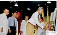  ?? ?? Honouring Dr. C.W.W. Kannangara by placing a bouquet of flowers by grandson looked up-on by the Minister of Education Dr. Susil Premajayan­tha, Mr Nimal Wakishta and Prof. S. Malimboda.