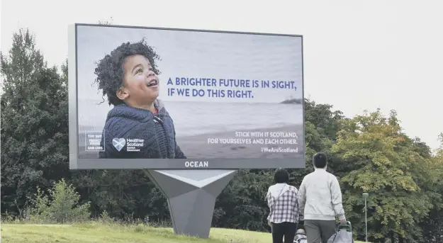  ?? PICTURE: JOHN DEVLIN ?? 0 A billboard in Glasgow displays one of the new Scottish Government advertisem­ents designed to lift morale as coronaviru­s restrictio­ns get tougher