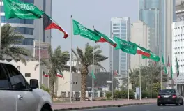  ??  ?? Kuwaiti and Saudi flags decorate a street in Kuwait City yesterday, ahead of the Saudi King’s visit to Kuwait.