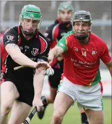  ??  ?? Anthony Roche of Oulart-The Ballagh gets to the ball ahead of Rapparees veteran Tomás Mahon.