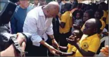  ??  ?? Saraki with kids at an IDPs’ camp in Benue