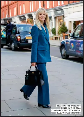  ?? ?? BEATING THE JANUARY BLUES IN THIS TEAL CORDUROY SUIT BY ASPIGA. BAG, VINTAGE HERMES