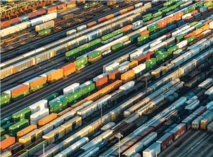  ?? DANNY KARNIK/ AP FILE ?? Freight train cars in a Norfolk Southern rail yard on Sept. 14 in Atlanta. Twelve rail unions must ratify their contracts to prevent a strike by freight workers.