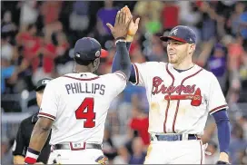  ?? KEVIN C. COX / GETTY IMAGES ?? Brandon Phillips’ move to third base could be the best thing that happened to him this season if he wants to continue playing in the majors.